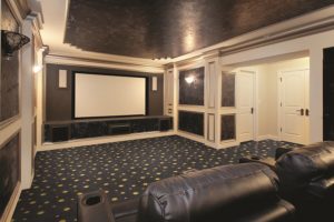 home theater with leather couch and black ceiling