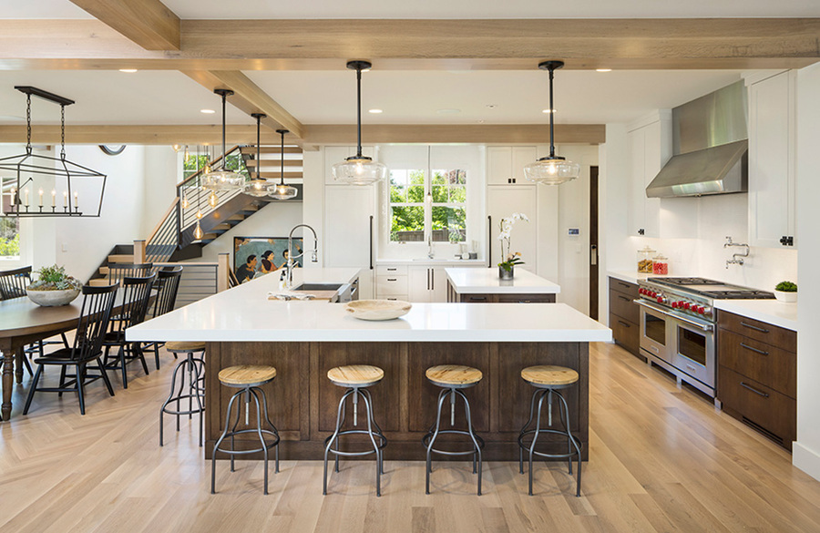 A well-illuminated kitchen with several types of fixtures installed.