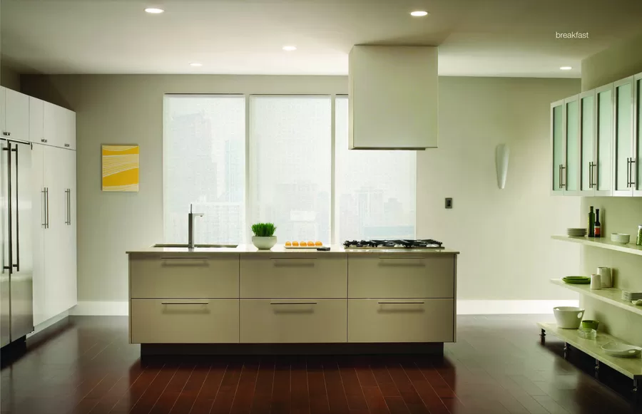A kitchen featuring Lutron lights and motorized shades.