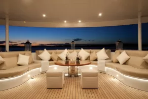 A relaxing area on a yacht with in-ceiling speakers.