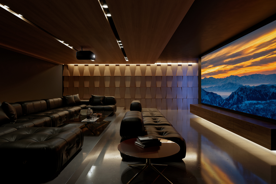 A home theater with a large movie screen, Sony projector, sectional seating, and acoustic paneling.