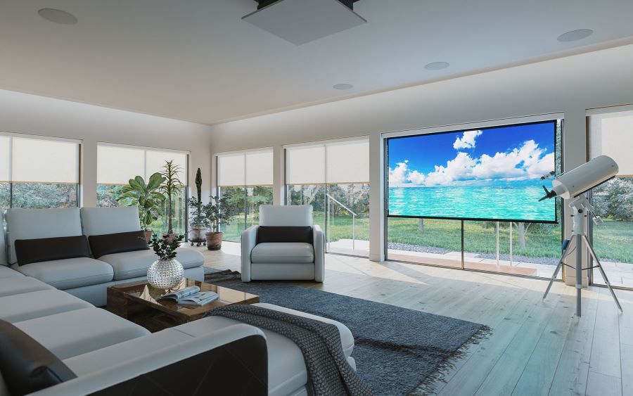 A media room with in-ceiling speakers, a projector, and a screen displaying an ocean.