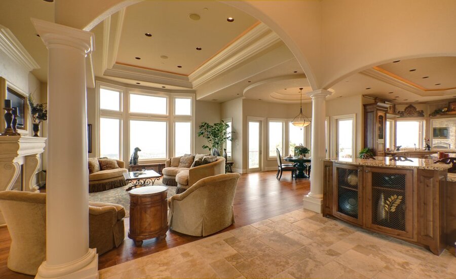 An open living space with in-ceiling speakers.
