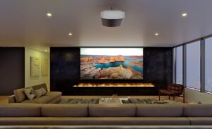 A large home theater with screen and fireplace.